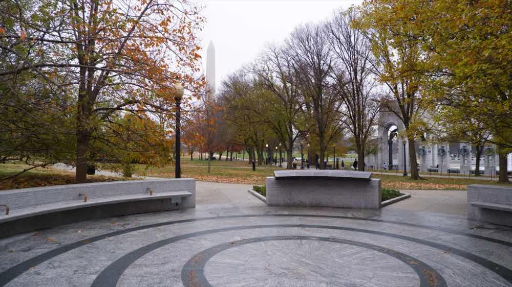 Circle of Remembrance with concentric granite paving, the Washington Monument on axis